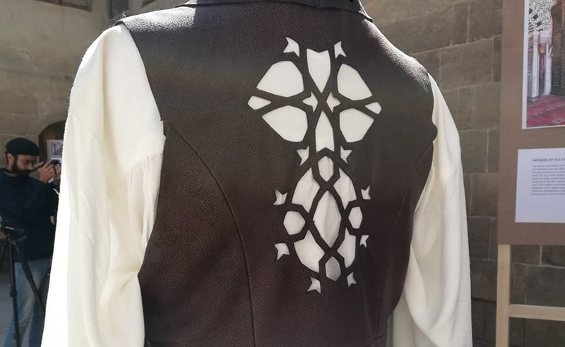Costume Designer Maya Gowaily Draws Inspiration from Looted Mamluk Minbar in Leather Vest Design