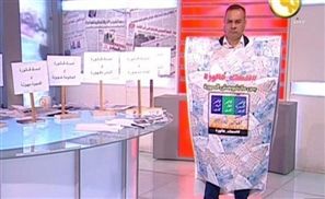 Egyptian Presenter Wears Gigantic Utility Bill In Protest of Increasing Energy Costs